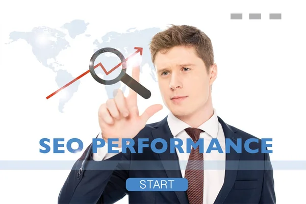 Successful businessman in suit pointing with finger at seo performance illustration on white background — Stock Photo