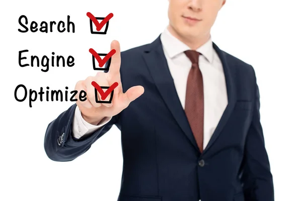 Partial view of businessman in suit pointing with finger at seo tips illustration — Stock Photo