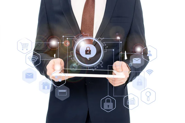 Cropped view of businessman holding digital tablet in hands with internet security icons above — Stock Photo