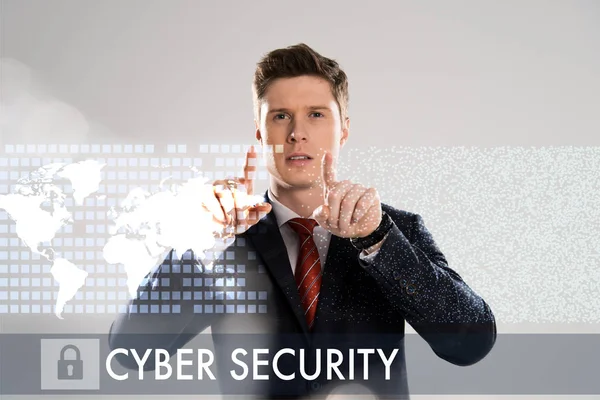 Confident businessman in suit pointing with fingers at cyber security illustration in front — Stock Photo