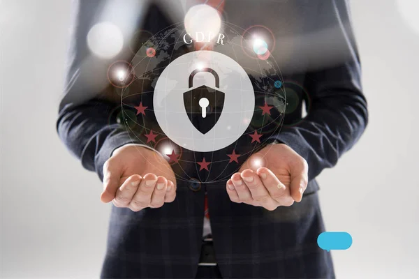 Cropped view of businessman in suit with outstretched hands and gdpr letters and lock illustration in front — Stock Photo