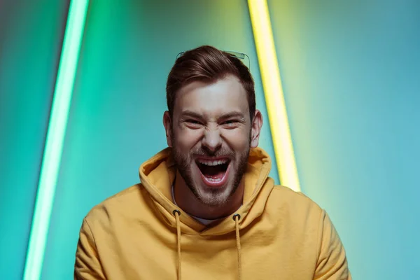 Happy, handsome and screaming man looking at camera — Stock Photo