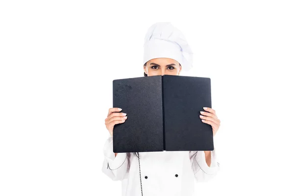 Chef in uniform holding black book isolated on white — Stock Photo