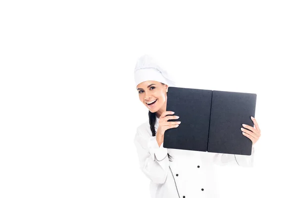 Chef em uniforme segurando livro preto isolado em branco — Fotografia de Stock