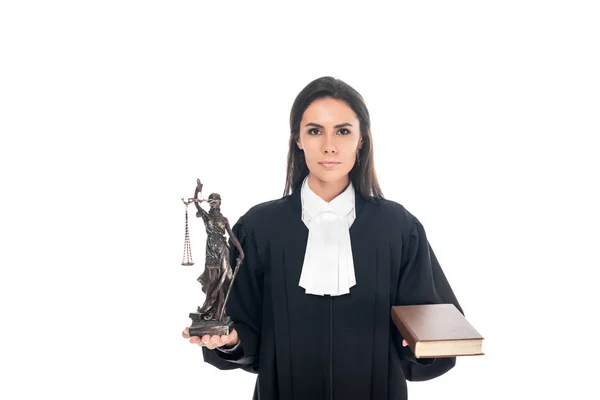 Judge in judicial robe holding themis figurine and book isolated on white — Stock Photo