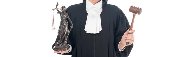 Panoramic shot of judge in judicial robe holding gavel and themis figurine isolated on white — Stock Photo