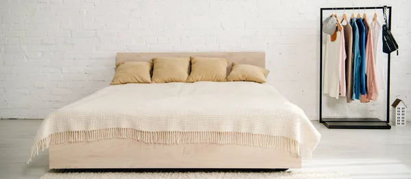 Big bed with cushions and blanket in teenage bedroom — Stock Photo