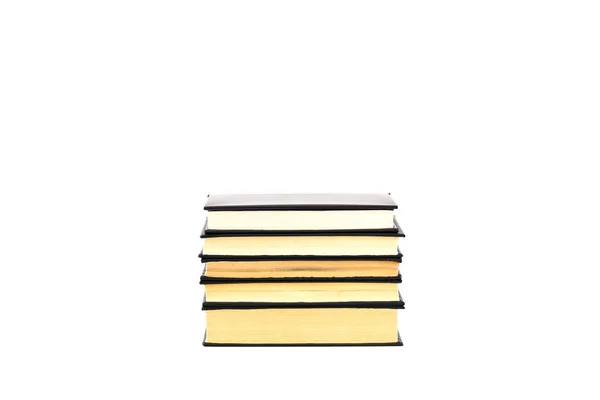 Old black hardcover books with yellow pages isolated on white — Stock Photo