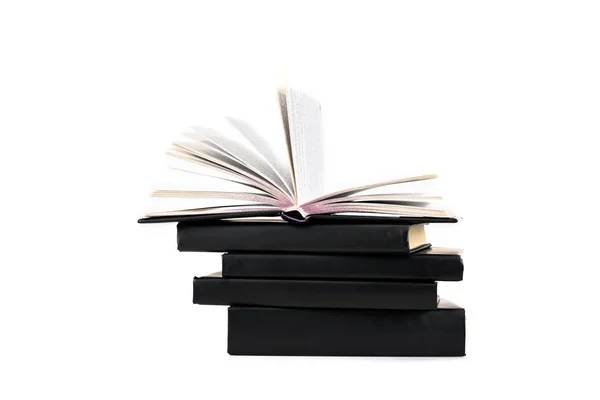 Stack of black hardcover books isolated on white — Stock Photo