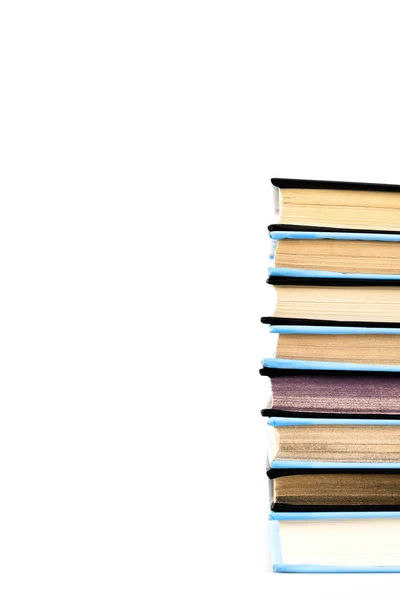 Pila di libri neri e blu isolati su bianco — Foto stock