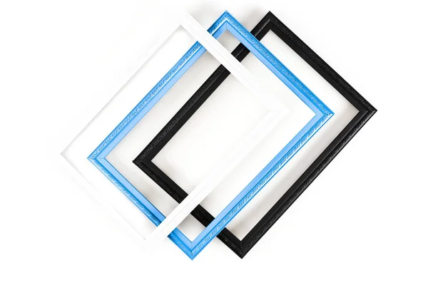 Vista superior de tres marcos en superficie blanca - foto de stock