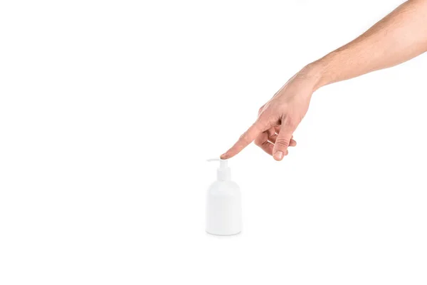 Vue partielle de l'homme poussant pulvérisation sur la bouteille de crème isolé sur blanc — Photo de stock