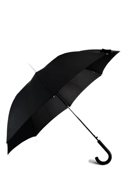 Open big black umbrella with plastic handle on white — Stock Photo