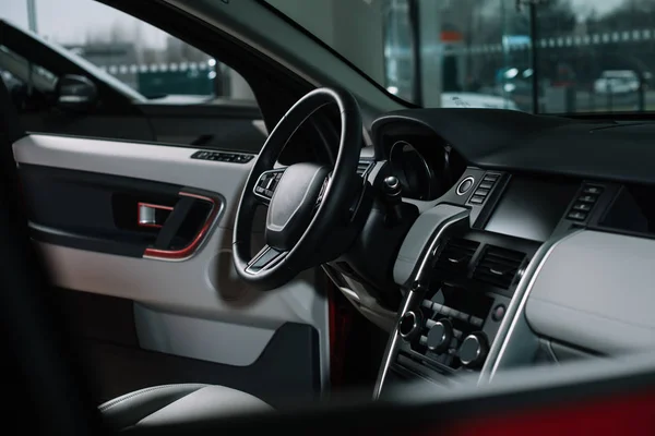 Buttons near black steering wheel in luxury car — Stock Photo