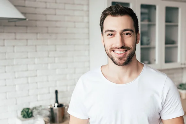 Front view of smiling bearded man looking at camera — Stock Photo