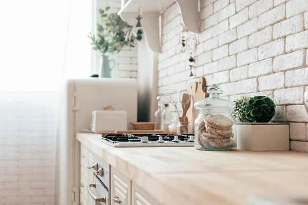 Modern kitchen with fridge, oven and cooking utensils — Stock Photo