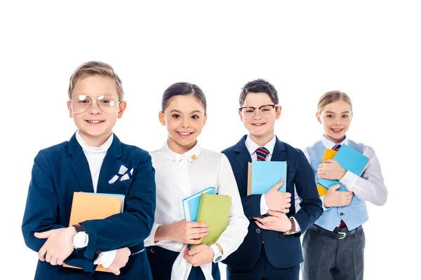 Glückliche Schulkinder, die sich mit Büchern auf weißem Papier als Geschäftsleute ausgeben — Stockfoto