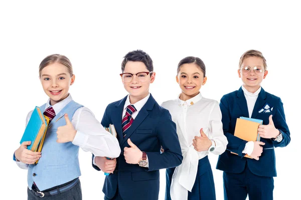 Smiling schoolchildren pretending to be businesspeople with books showing thumbs up Isolated On White — Stock Photo
