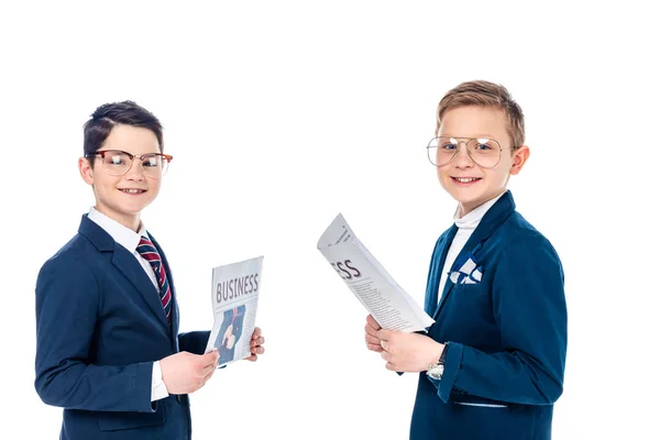 Happy schoolboys pretending to be businessmen holding newspapers Isolated On White — Stock Photo