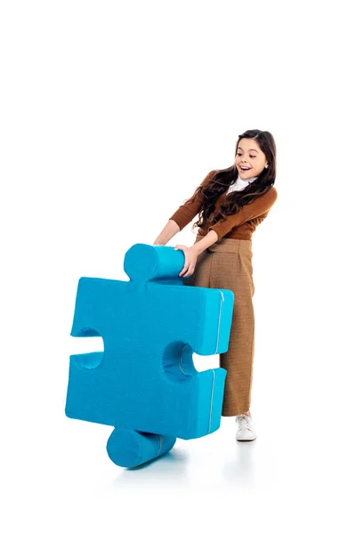 Excited kid with jigsaw puzzle piece on white — Stock Photo