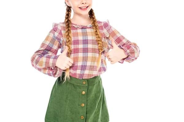 Vista recortada de un niño sonriente mostrando signos de pulgar hacia arriba aislado en blanco - foto de stock