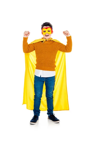Happy boy in superhero costume with clenched fists on white — Stock Photo