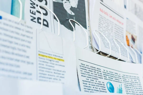 Selective focus of daily print newspapers on stand — Stock Photo