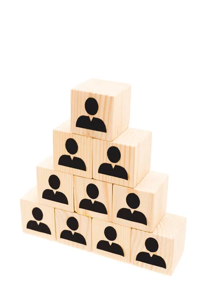 Pyramid made of wooden blocks with human icons isolated on white — Stock Photo