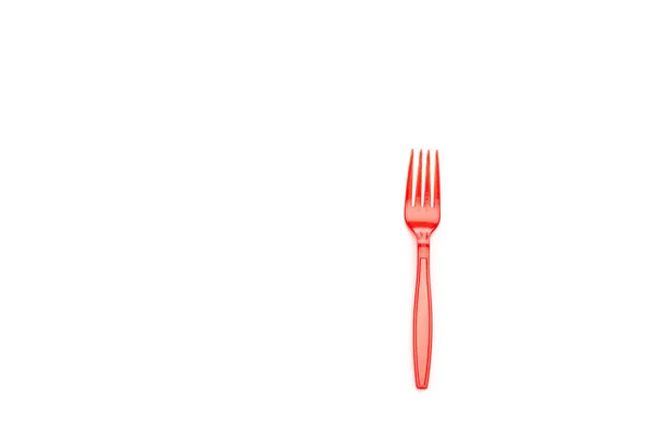 Red plastic bright fork isolated on white with copy space — Stock Photo