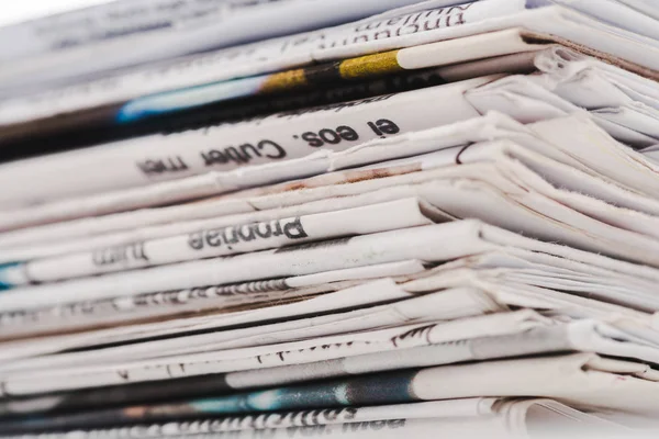 Close up of different print daily newspapers in stack — Stock Photo