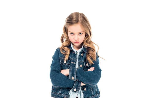 Front view of sad child in denim jacket standing with crossed arms isolated on white — Stock Photo