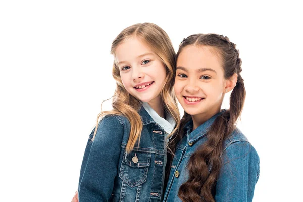 Two kids in denim jackets looking at camera isolated on white — Stock Photo