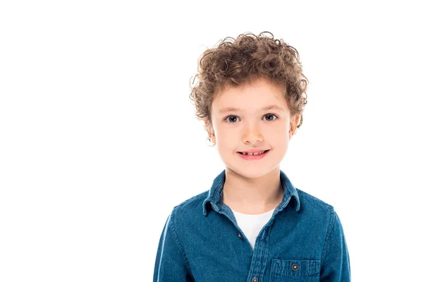 Visão frontal da criança encaracolada em camisa jeans olhando para a câmera isolada no branco — Fotografia de Stock