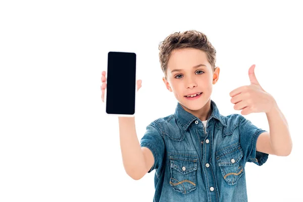 Front view of kid holding smartphone with blank screen and showing thumb up isolated on white — Stock Photo