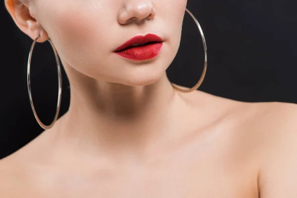 Cropped view of naked young woman in earrings isolated on black — Stock Photo