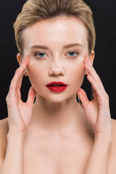 Pretty naked young woman looking at camera isolated on black — Stock Photo