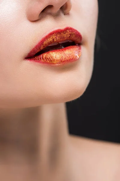 Cropped view of naked girl with orange lips isolated on black — Stock Photo