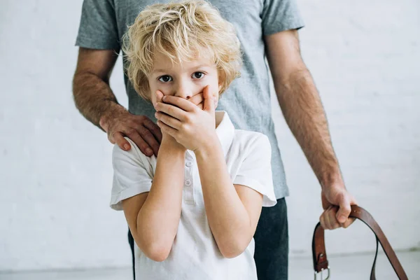 Cropped view of father and son having conflict at home — Stock Photo