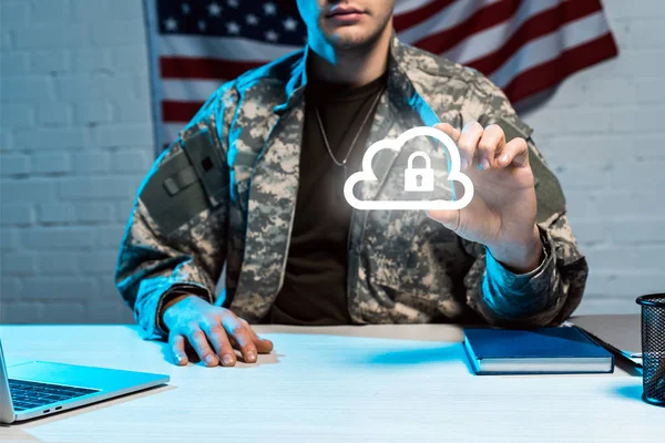 Cropped view of military man in uniform gesturing near cloud with padlock — Stock Photo