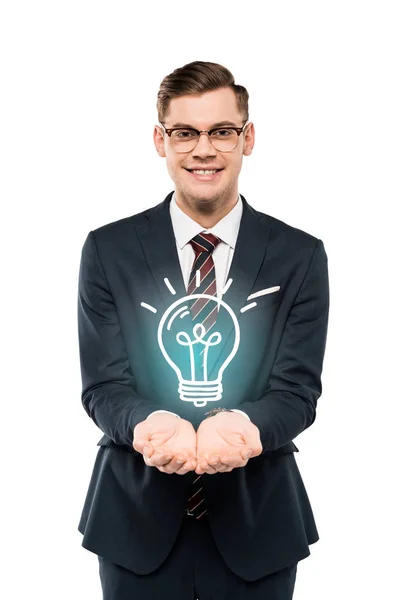 Cheerful businessman in glasses with cupped hands light bulb isolated on white — Stock Photo