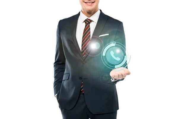 Cropped view of cheerful man in suit smiling and gesturing near phone icon on white — Stock Photo