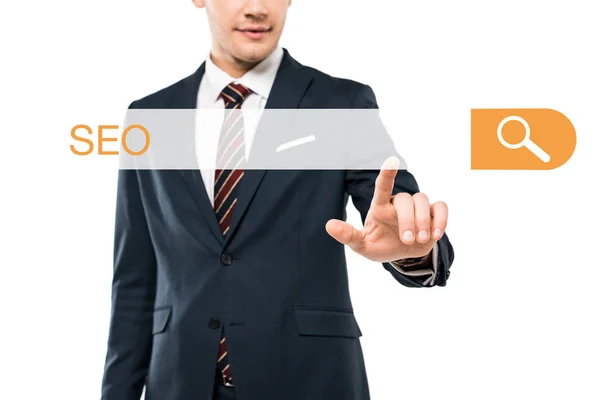 Cropped view of happy man in formal wear pointing with finger at address bar with seo lettering on white — Stock Photo