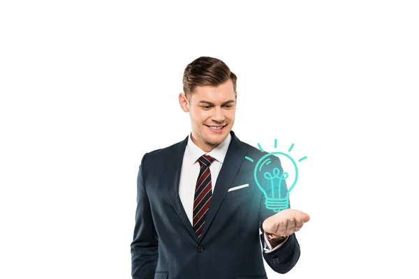 Happy young man in formal wear gesturing and looking at light bulb on white — Stock Photo