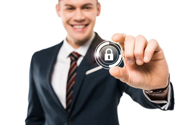 Selective focus of happy businessman gesturing and smiling while touching virtual padlock isolated on while — Stock Photo