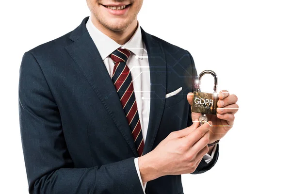 Vue recadrée de heureux homme d'affaires en costume tenant les clés et cadenas avec lettrage gdpr sur blanc — Photo de stock