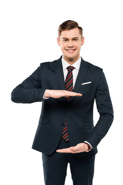Cheerful businessman gesturing and looking at camera isolated on white — Stock Photo