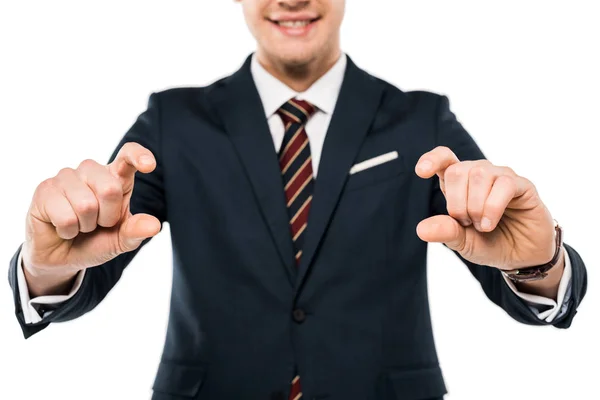 Cropped view of happy young man in suit gesturing with hands isolated on white — Stock Photo