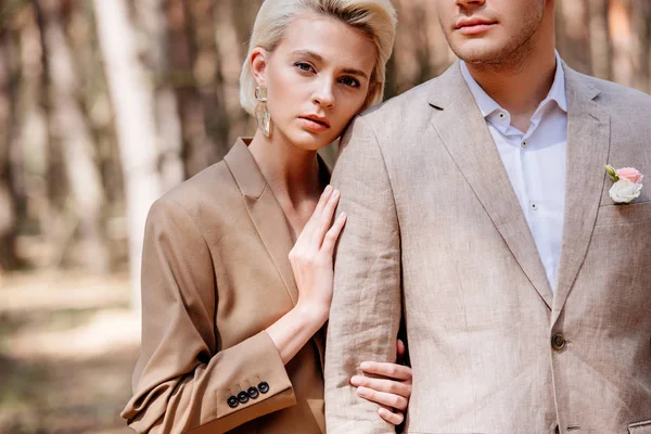 Partial view of man near beautiful woman in forest — Stock Photo