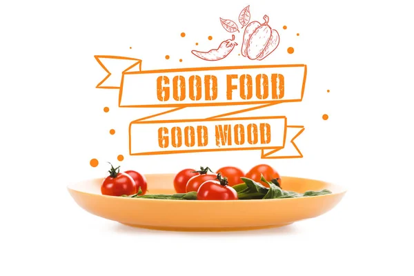 Pomodorini con foglie di spinaci verdi in piatto giallo con buon cibo buon umore lettering sopra isolato su bianco — Foto stock