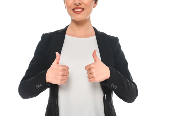 Recortado disparo de sonriente mestiza mujer de negocios mostrando pulgares hacia arriba aislado en blanco - foto de stock